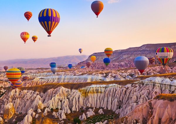 hot-air-balloon-flying-over-rock-landscape-at-cappadocia-turkey